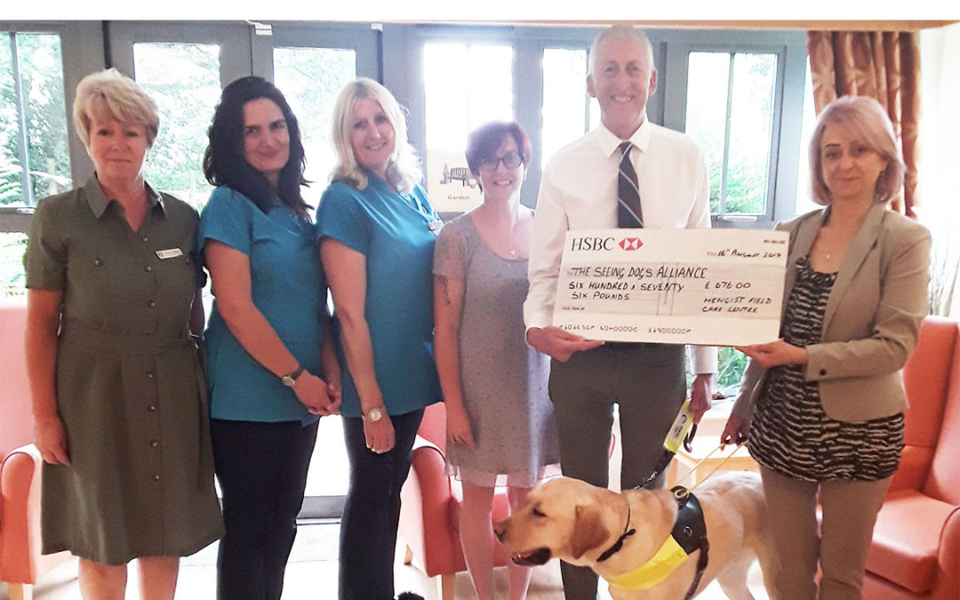Hengist Field Care Home presents cheque to The Seeing Dogs Alliance