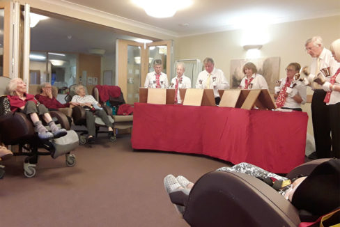 Residents enjoying the Upchurch Hand Bell Ringers performing at Hengist Field Care Home