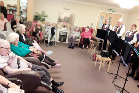 Residents at Hengist Field Care Home enjoying music from The Maypole Minstrels in their lounge