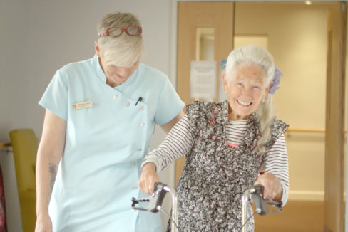Hengist Field Care Home resident Eileen taking a walk with Senior Healthcare Assistant Donna Horn (Picture: September 2019)