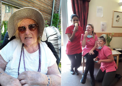 Resident in a sun hat and staff enjoying ice creams at Hengist Field Care Home