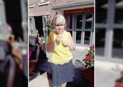 Resident enjoying ice-creams and lollies in the garden at Hengist Field Care Home 3