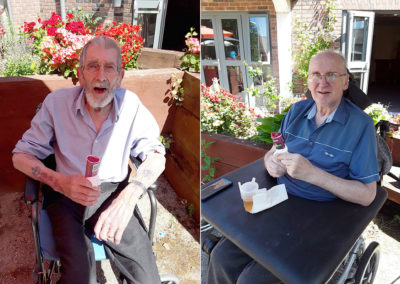 Two Hengist Field Care Home gentlemen residents smiling with ice lollies in the garden