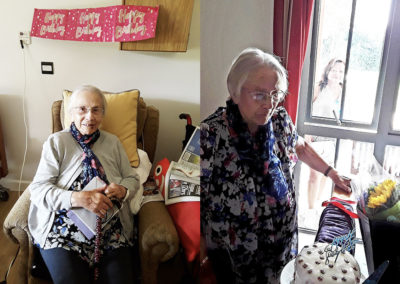 Resident with cards and presents on her birthday at Hengist Field Care Home