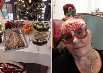 Hengist Field trolley of festive food and a resident wearing a Christmas glasses