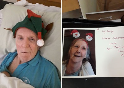 Resident in festive hat at a home made Christmas card at Hengist Field Care Home