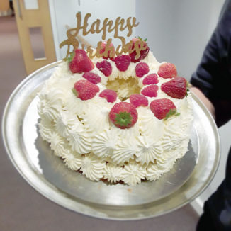 A strawberries and cream birthday cake