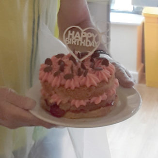 An iced birthday cake at Hengist Field Care Home