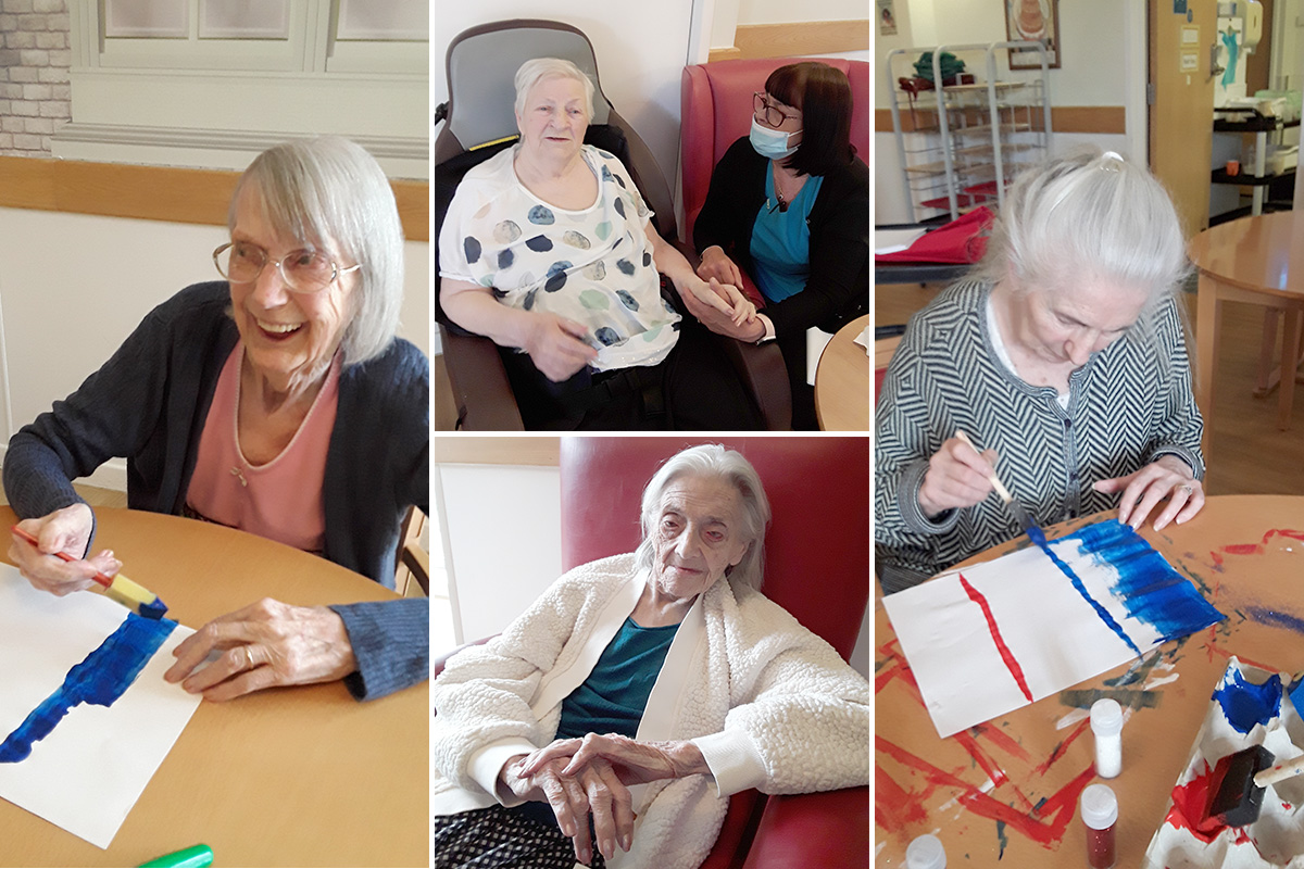 Hengist Field Care Home residents painting French flags and showing off their painted nails
