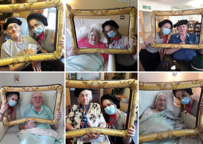 Residents and staff taking French themed selfie photos at Hengist Field Care Home