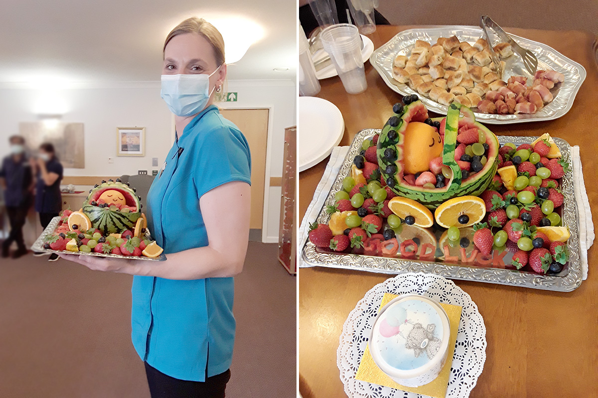 Staff member with her baby fruit decoration at Hengist Field Care Home