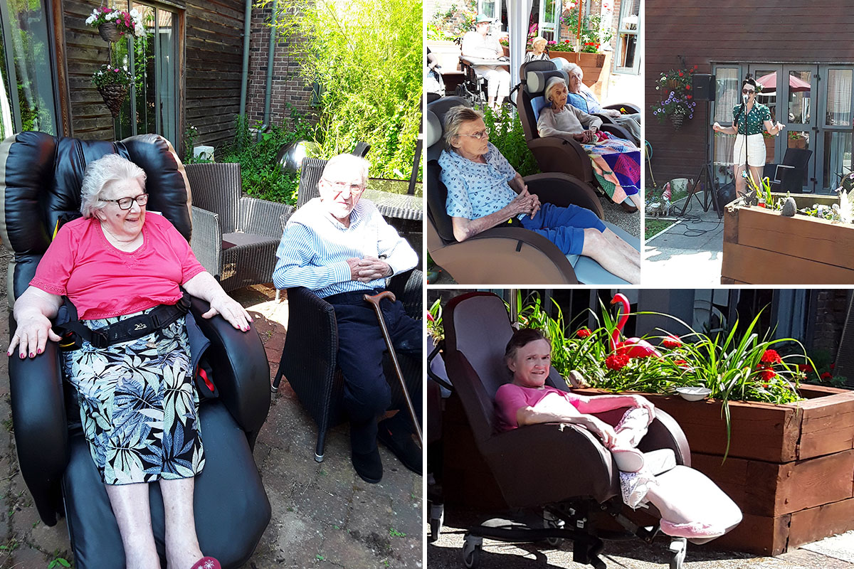 Hengist Field Care Home residents watching Miss Holiday Swing perform in their garden 