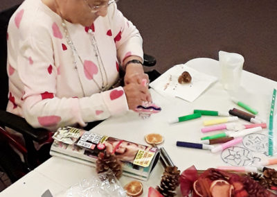 Resident making festive decorations at Hengist Field Care Home