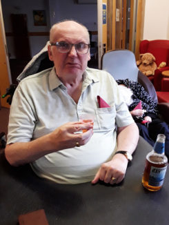 Resident at Hengist Field Care Home pulling a face after sampling a beer
