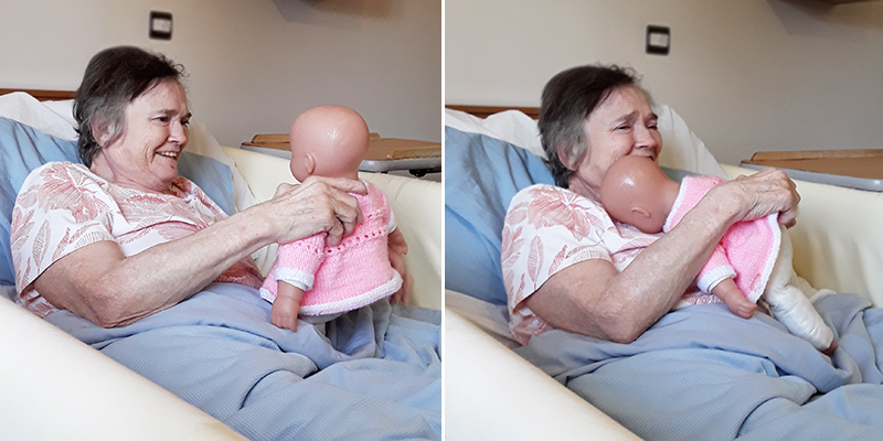 Hengist Field Care Home resident cuddling a baby doll