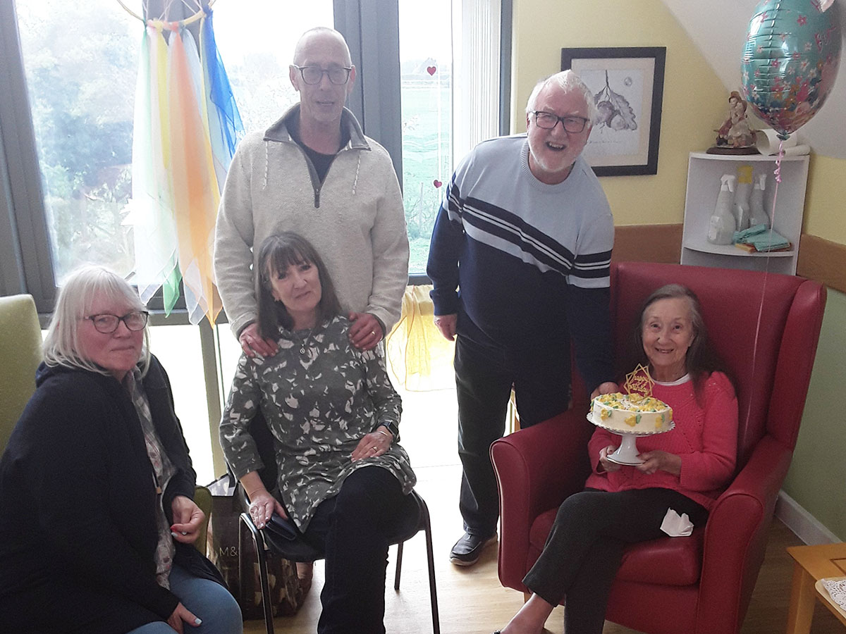 Rita celebrating her birthday with her family at Hengist Field Care Home